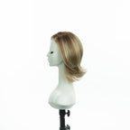 8.5-inch champagne blonde layered bob wig, profile facing left with flipped ends
