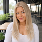 14-inch pastel blonde blend straight hair topper worn on a cafe terrace