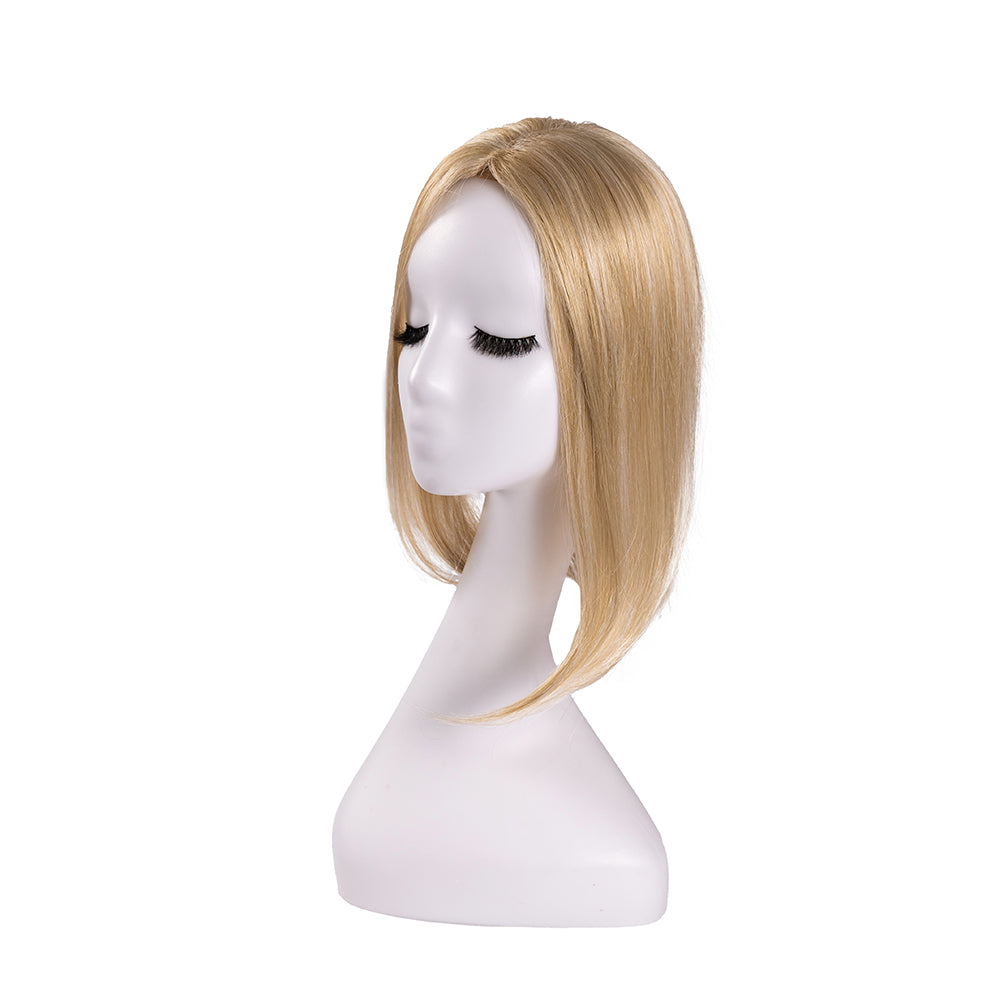 14-inch pastel blonde straight hair topper on a mannequin, showing the parting and shape