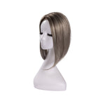 14-inch grey straight hair topper on a mannequin, showing the parting and shape