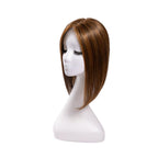 14-inch chocolate brown straight hair topper on a mannequin, showing the parting and shape
