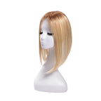 14-inch rooted pastel blonde straight hair topper on a mannequin, showing the parting and shape