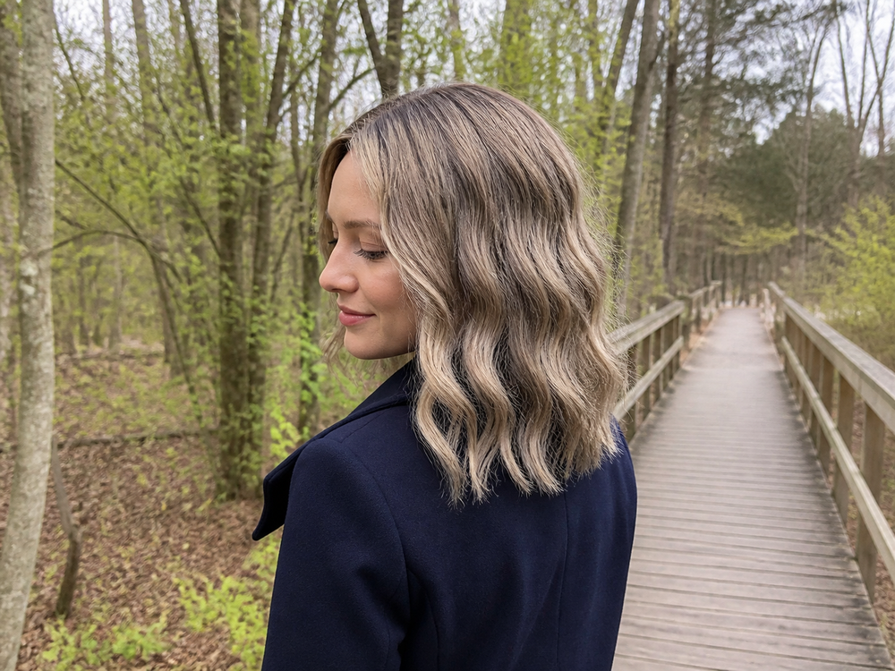 Model wearing a 14-inch wavy synthetic hair topper