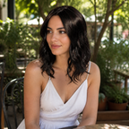 14-inch black wavy hair topper worn on a garden terrace