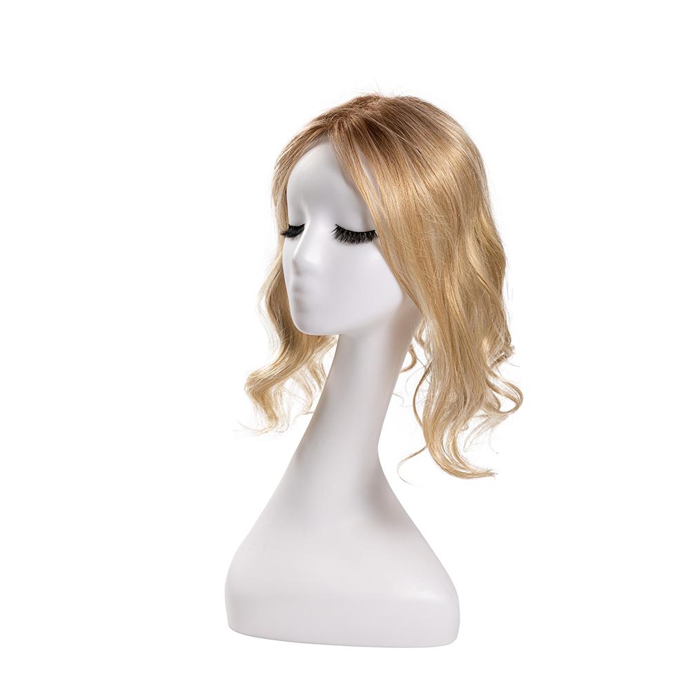 14-inch rooted pastel blonde wavy hair topper on a mannequin, showing the parting and shape