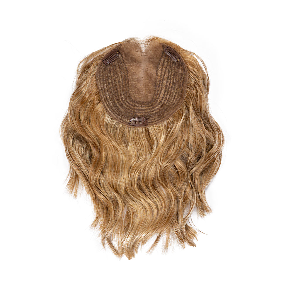 Underside of a 12-inch wavy hair topper showing the base and attachment clips