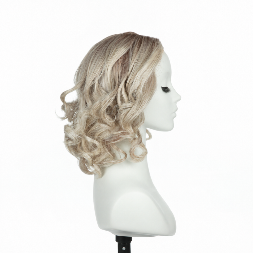 Right profile of rooted platinum blonde loose curly bob synthetic wig