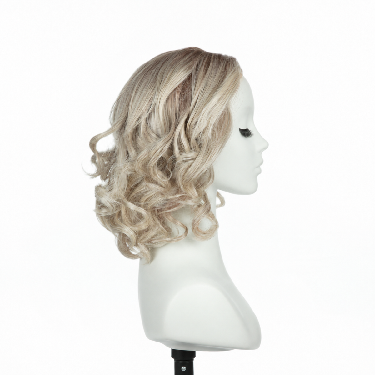 Right profile of rooted platinum blonde loose curly bob synthetic wig
